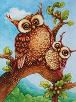 Две совушки на молодой дубовой ветке