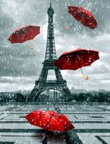 Парящие красные зонтики на фоне Эйфелевой башни
