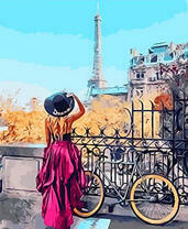 Девушка с велосипедом смотрит на Эйфелеву башню