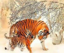 Тигрёнок с тигрицей под заснеженным деревом