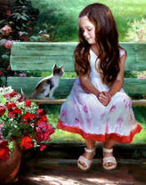 Милая девочка и котенок на скамейке