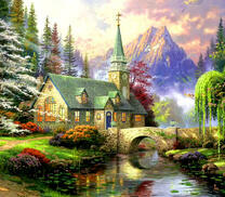 Каменный костел в еловом лесу возле гор