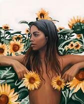 Обнаженная девушка в молодых подсолнухах