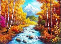 Осенняя река в лесу и снежный пик горы