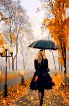 Девушка под черным зонтом в осеннем парке