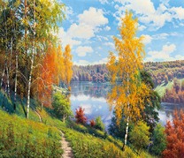 Яркие осенние березке на холме у реки